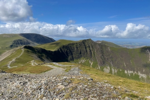 View of the arc and sheer drop of Hobcarton crag